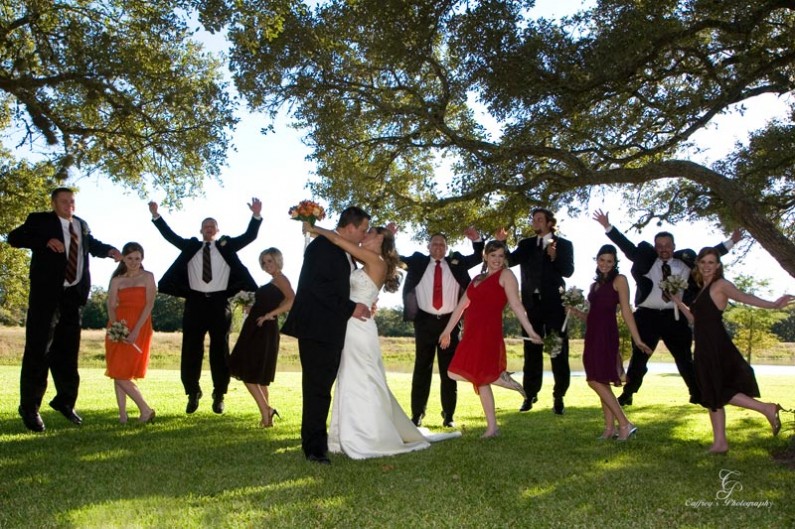 Fun photo of the wedding party jumping and having a great time after the wedding at The Phoenix Rising.