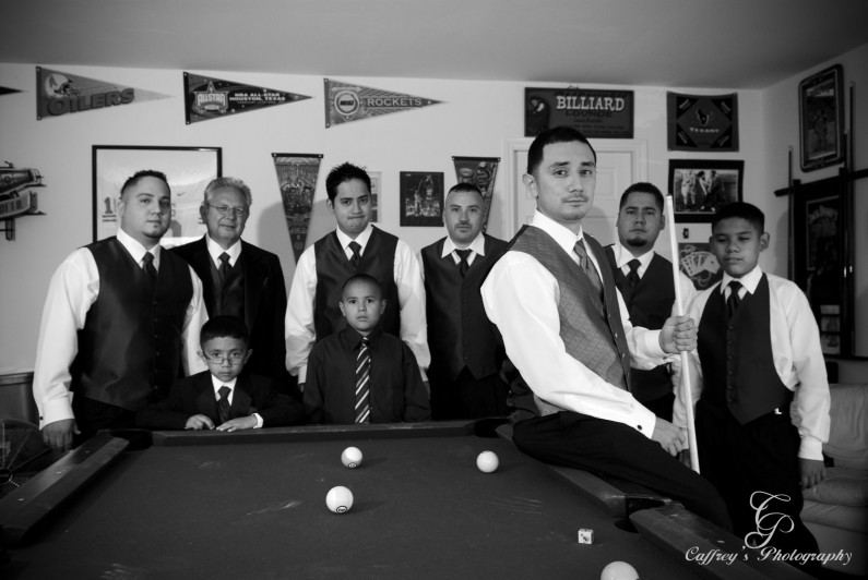 The groom and his guys hanging out in the pool room at their house before the wedding at Cindy's Palace.