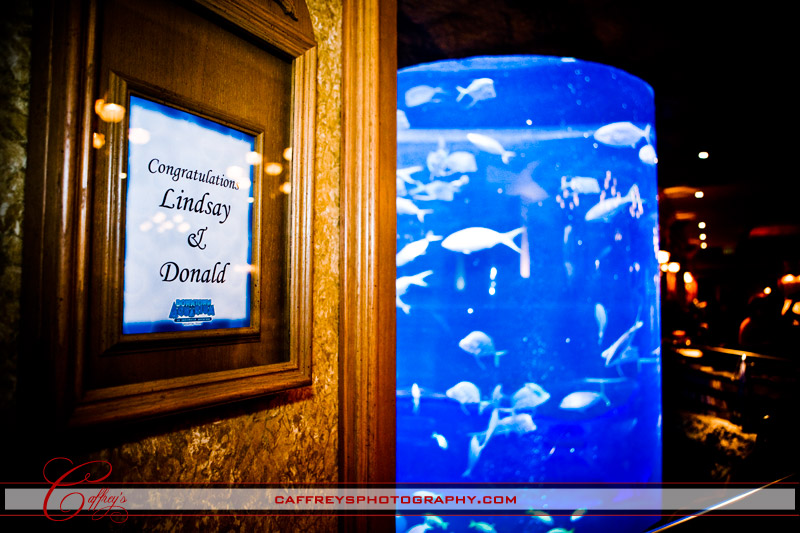 Sign displaying the bride and grooms name at the entry to the Downtown Aquarium in Houston. 