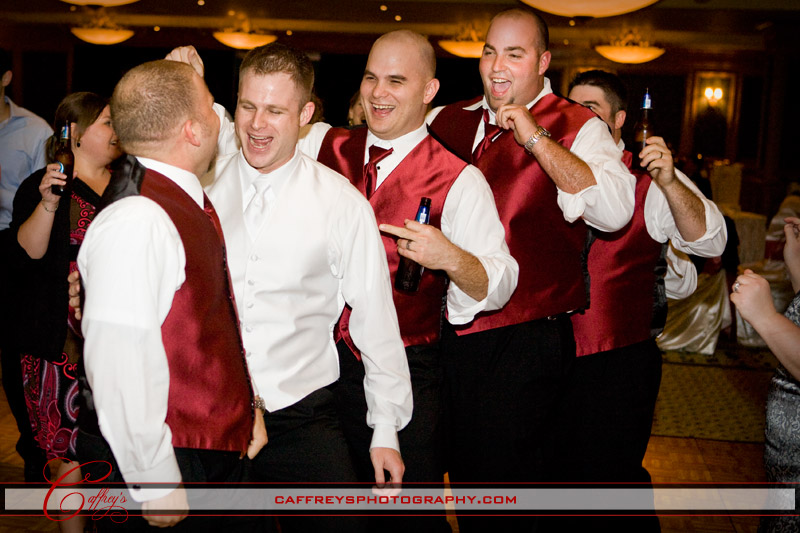 Groom with his groomsmen having a blast at the wedding reception in Houston.