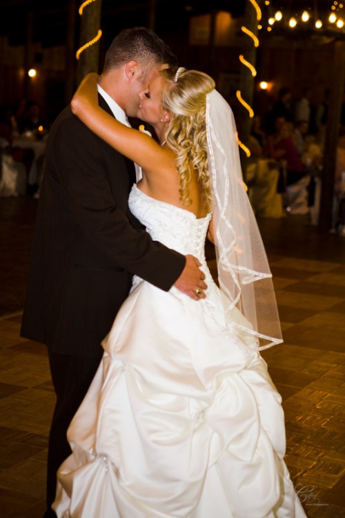 Captivating bride and her new husband during their first dance during their safari texas ranch wedding. 
