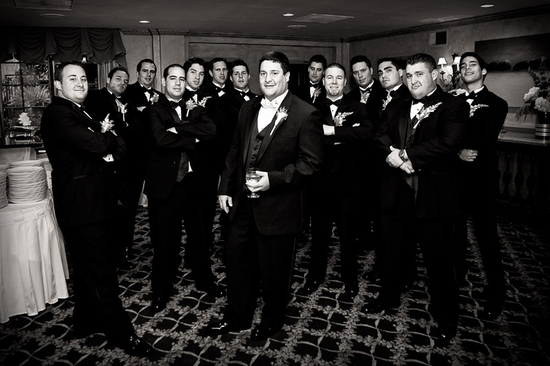 The groom and all of his guys hanging out in the foyer waiting for the wedding. 
