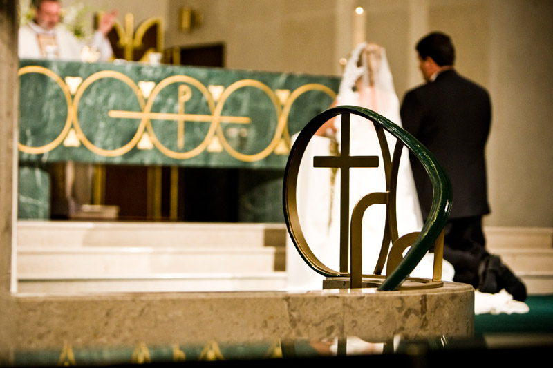 Unique image of the cross during the Catholic wedding at St Michaels in Houston. 