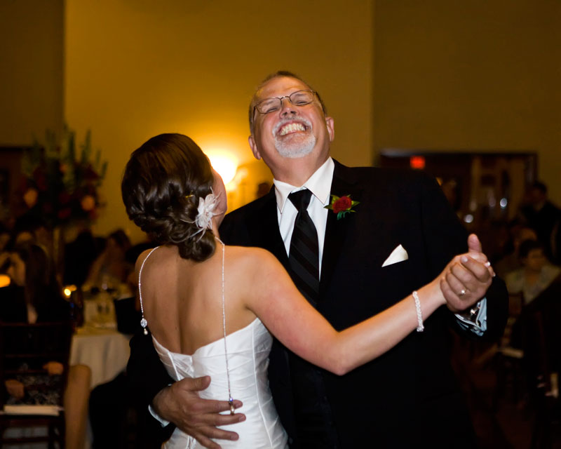 Father of the bride laughing during the father daughter dance at Briscoe. 