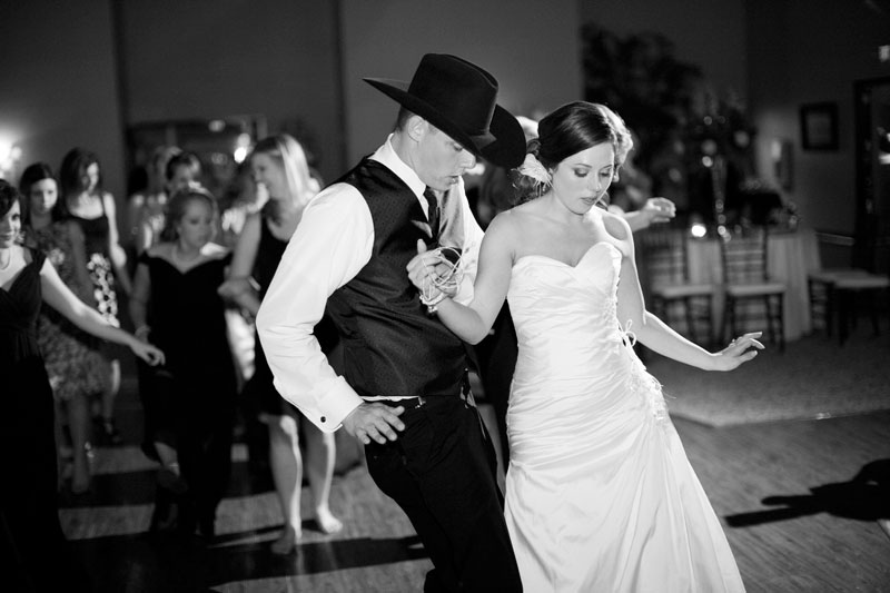 Happy bride and groom dancing during their wedding reception. 