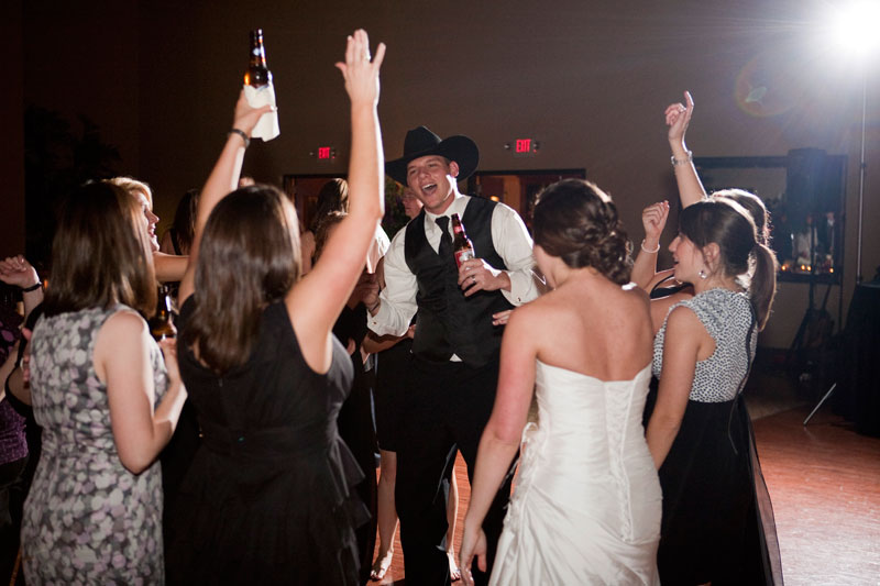 Groom and friends having a blast during the wedding reception.