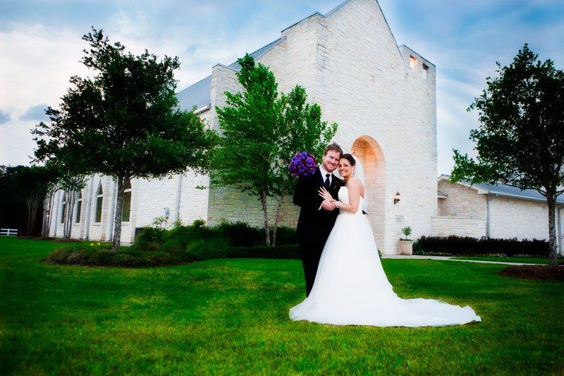 Happy bride and groom outside the wedding chapel at Briscoe Manor.