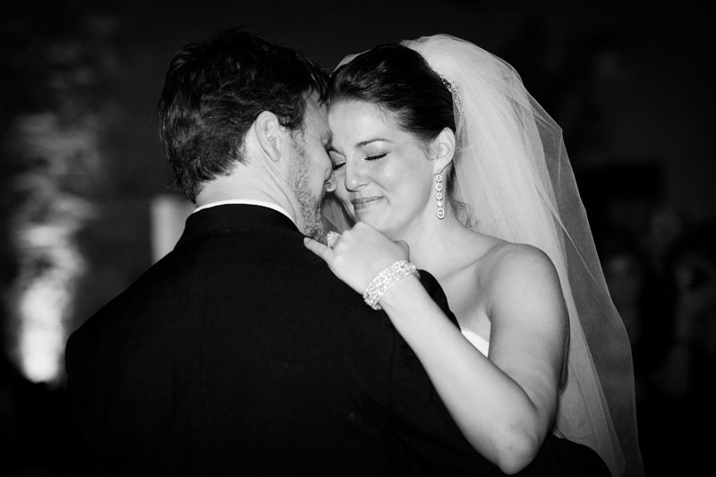 Emotional bride during her first dance with her new husband.
