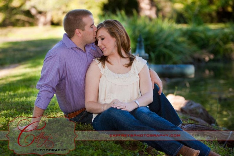 Groom kissing fiances forehead in their engagment pics.