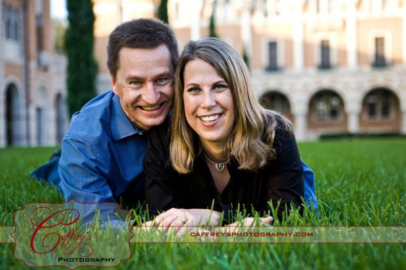 Super cute engagement photo in the grass at Rice University.