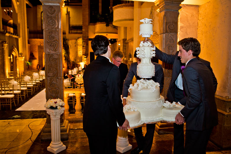 Las Velas Houston Wedding Groom moving towering wedding cake