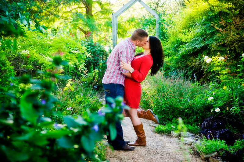 Romantic country Engagment portraits kissing flowers Caffreys Photography