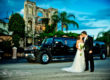 Las Valas Houston Wedding bride and groom posing with hummer limo