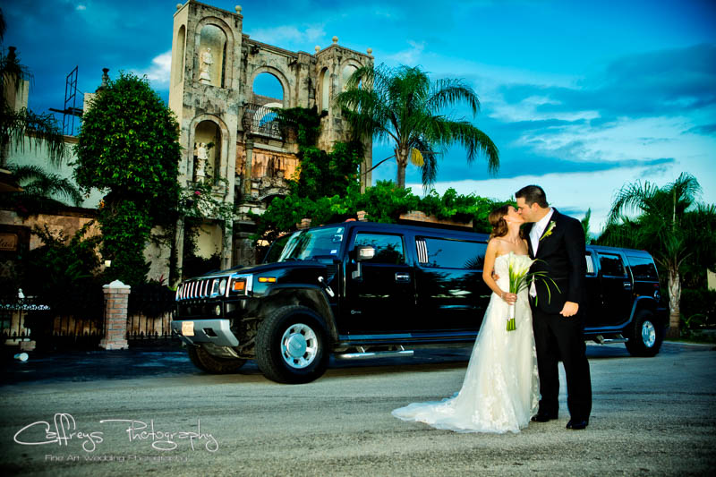 Las Valas Houston Wedding bride and groom posing with hummer limo